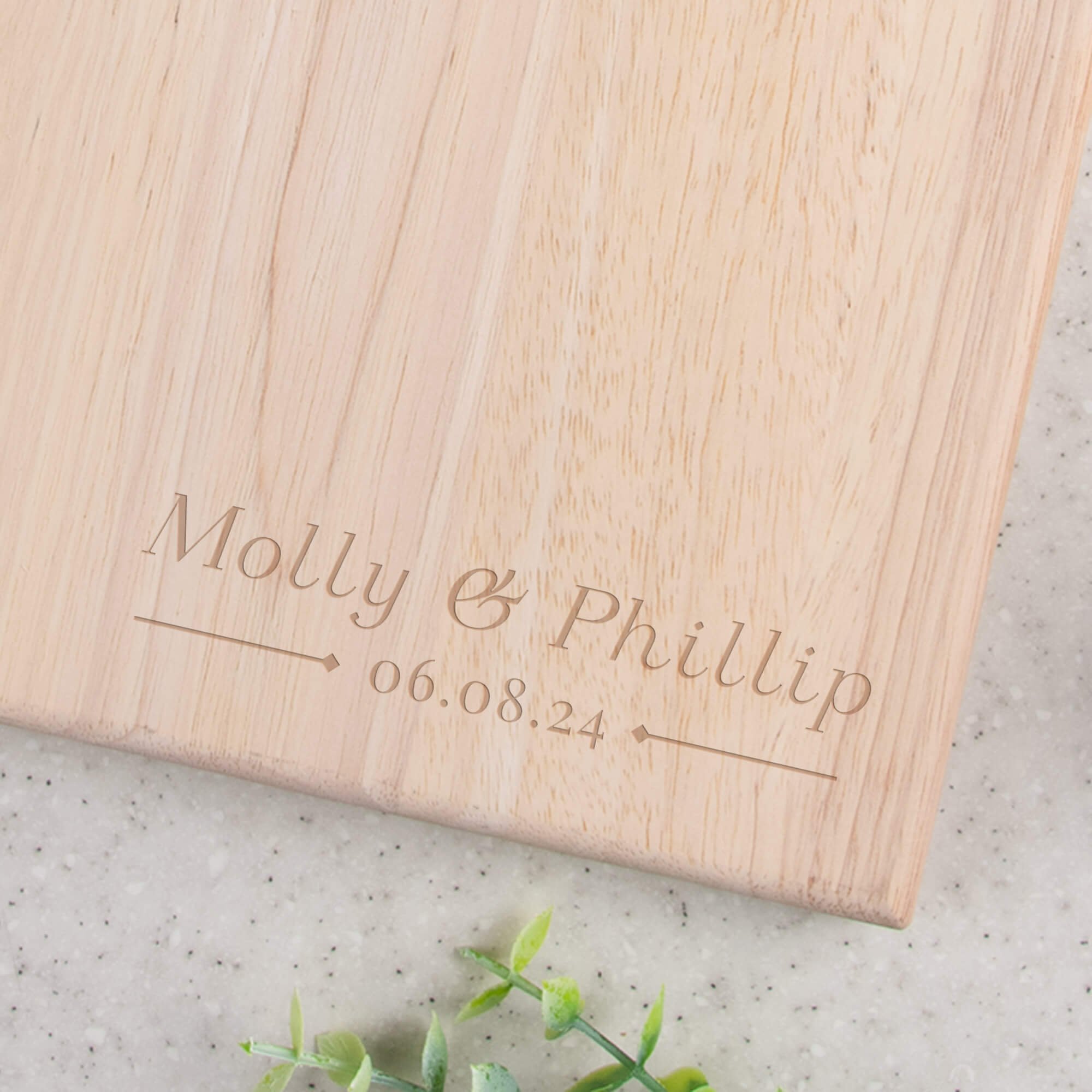 Custom Name and Date Paddle Style Engraved Serving Board closeup of design on bottom right corner of the board