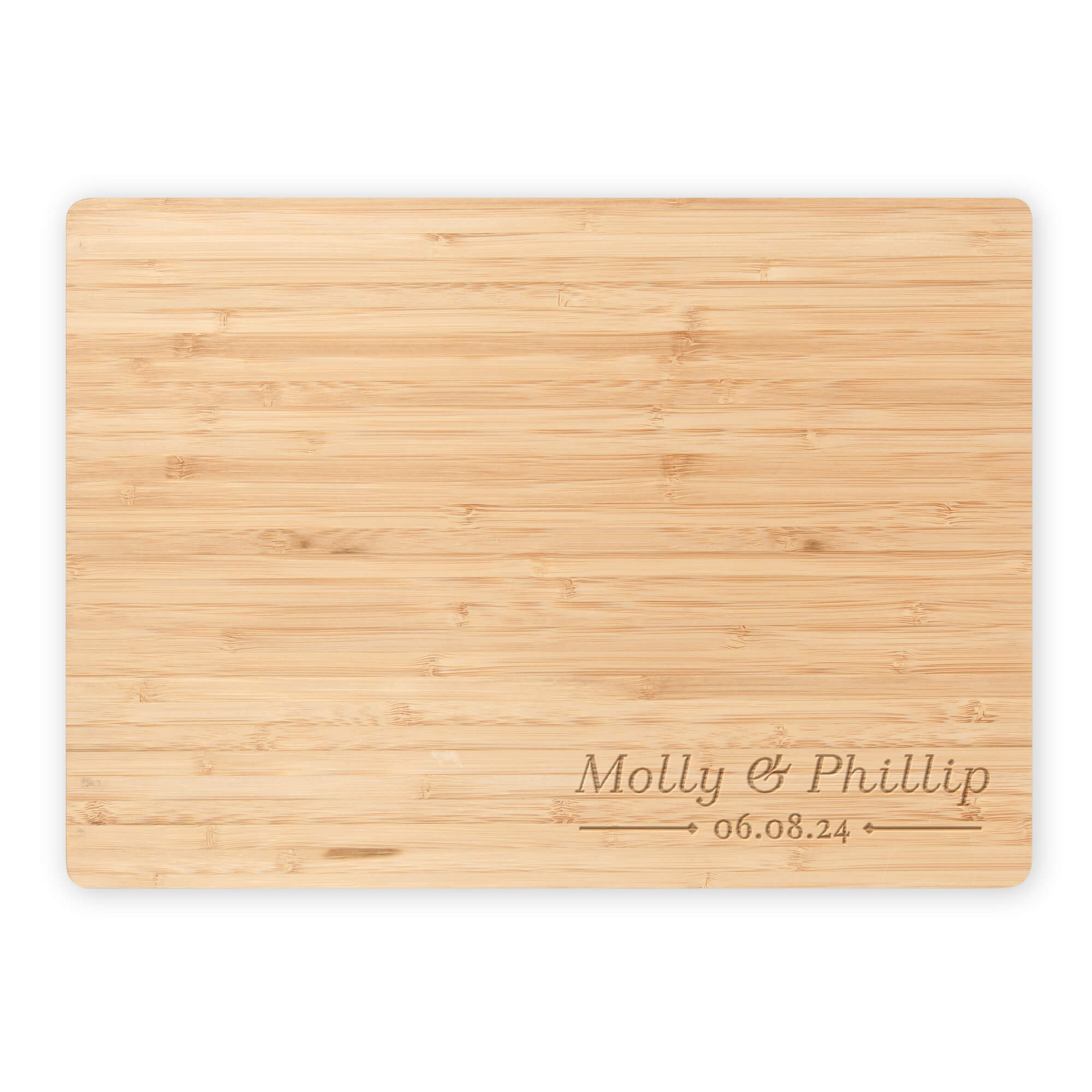 Flat lay of bamboo cutting board engraved with “Molly & Phillip” and date, shown on a white background for product detail view.