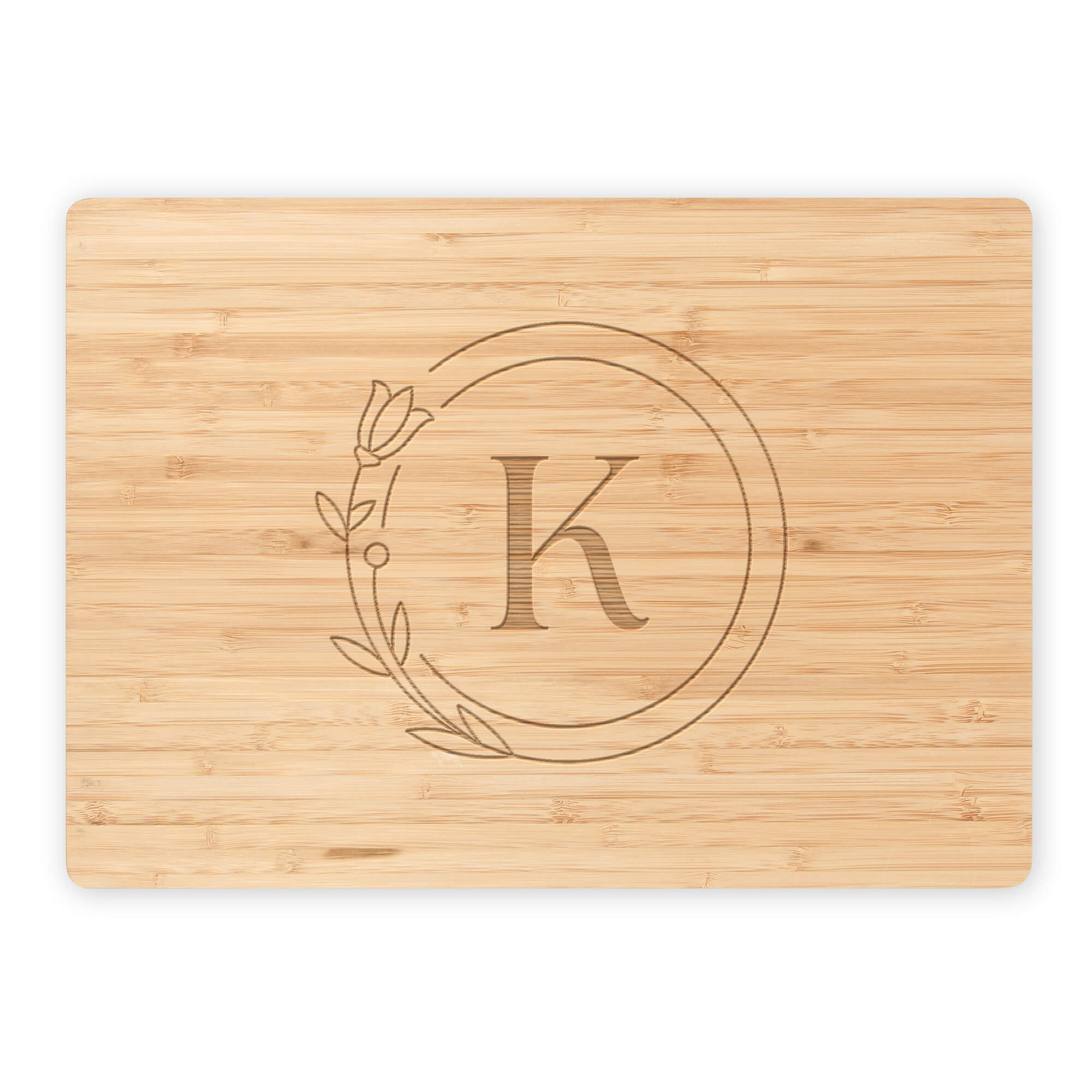 Personalized bamboo cutting board with circle monogram K on white background