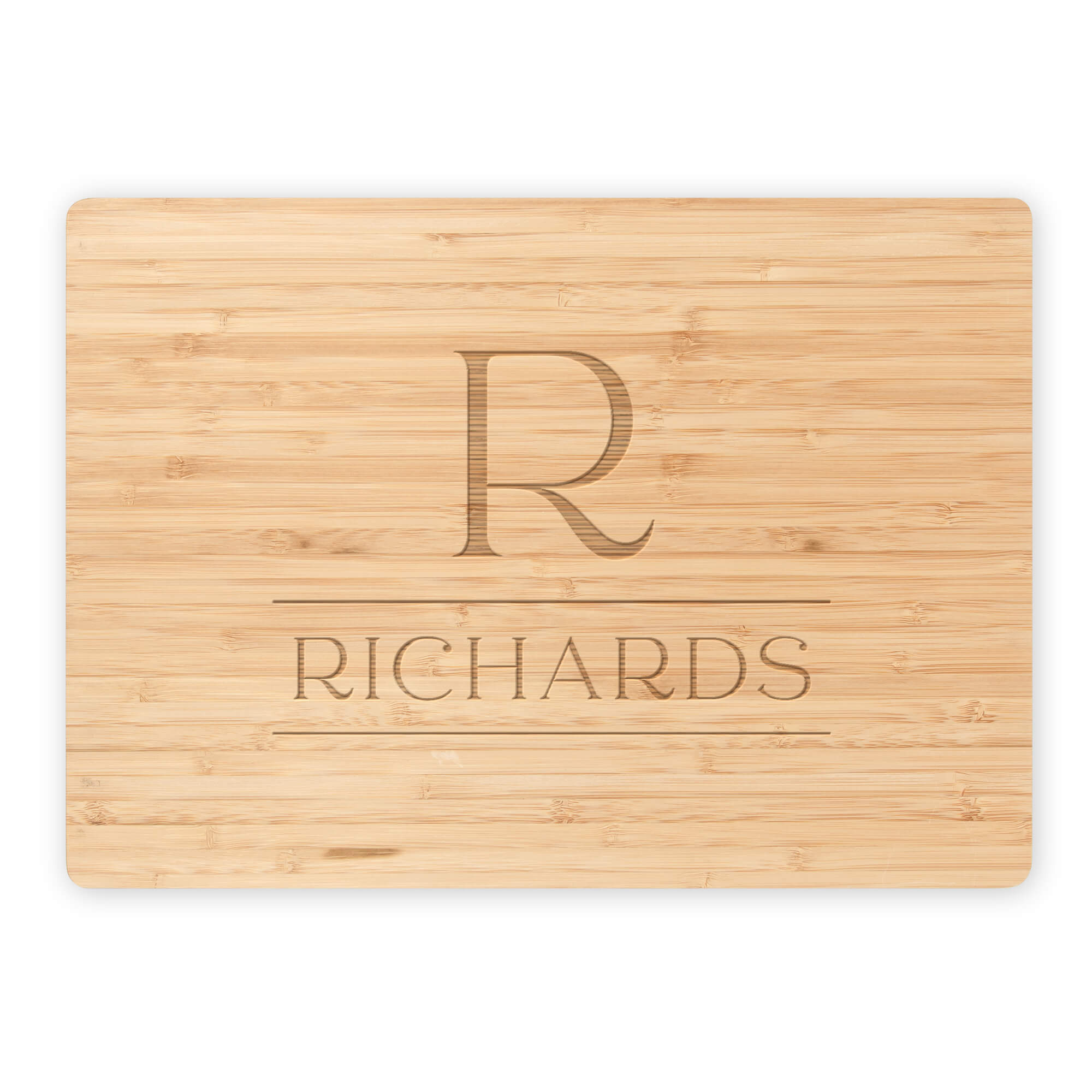 Bamboo cutting board featuring engraved serif R monogram and Richards family name on white background