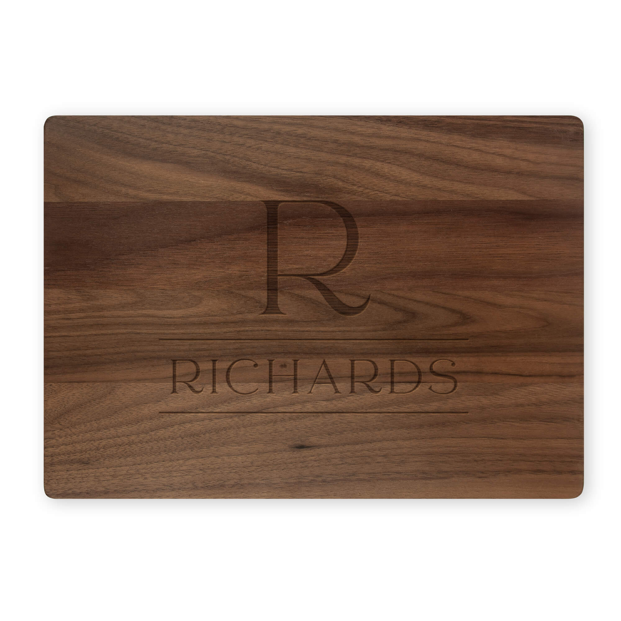 Walnut cutting board featuring engraved serif R monogram and Richards family name on white background