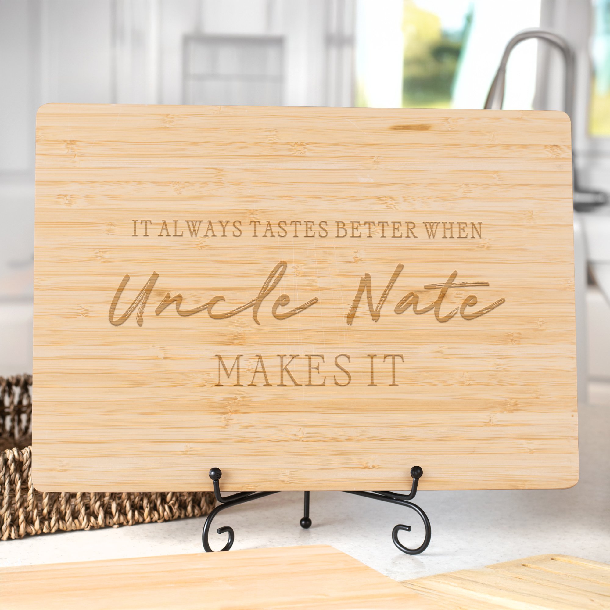 Personalized bamboo cutting board engraved with “It Always Tastes Better When Uncle Nate Makes It.” Custom family gift for home cooks or barbecue lovers.