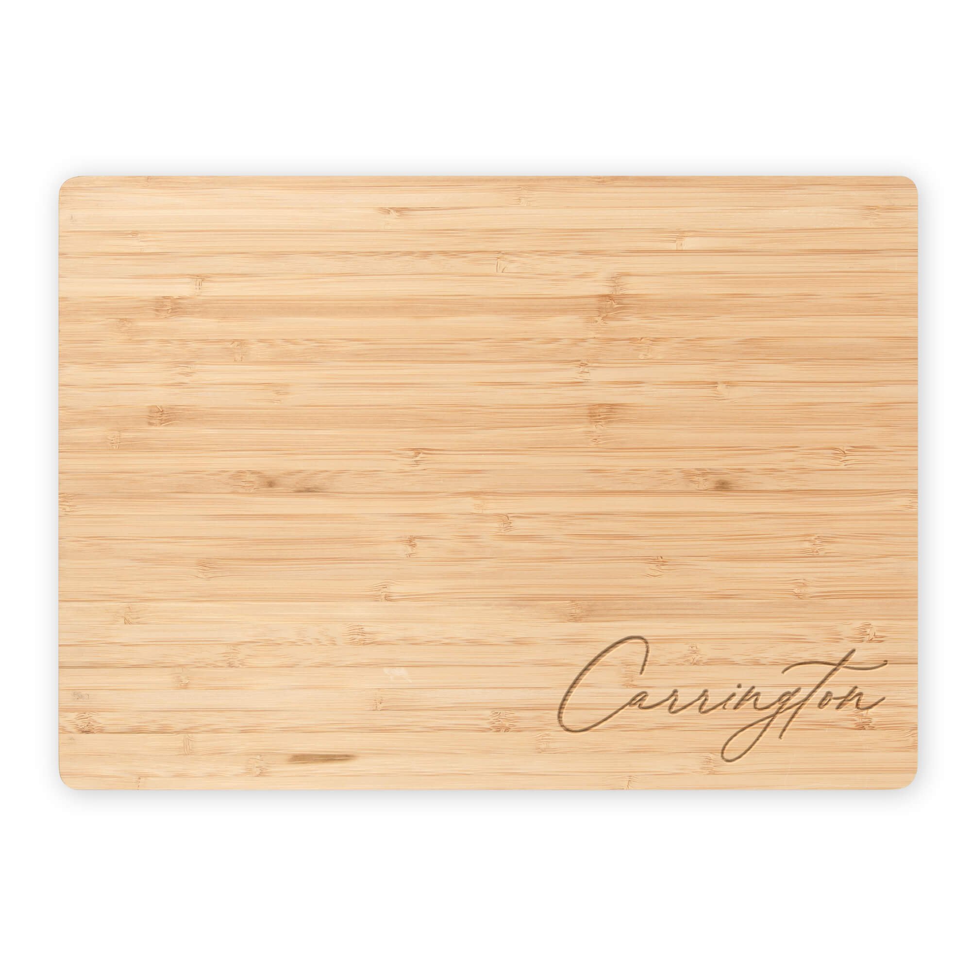 Engraved bamboo cutting board with “Carrington” script personalization. Custom name cutting board or engraved bamboo serving board for home chefs and gift giving.