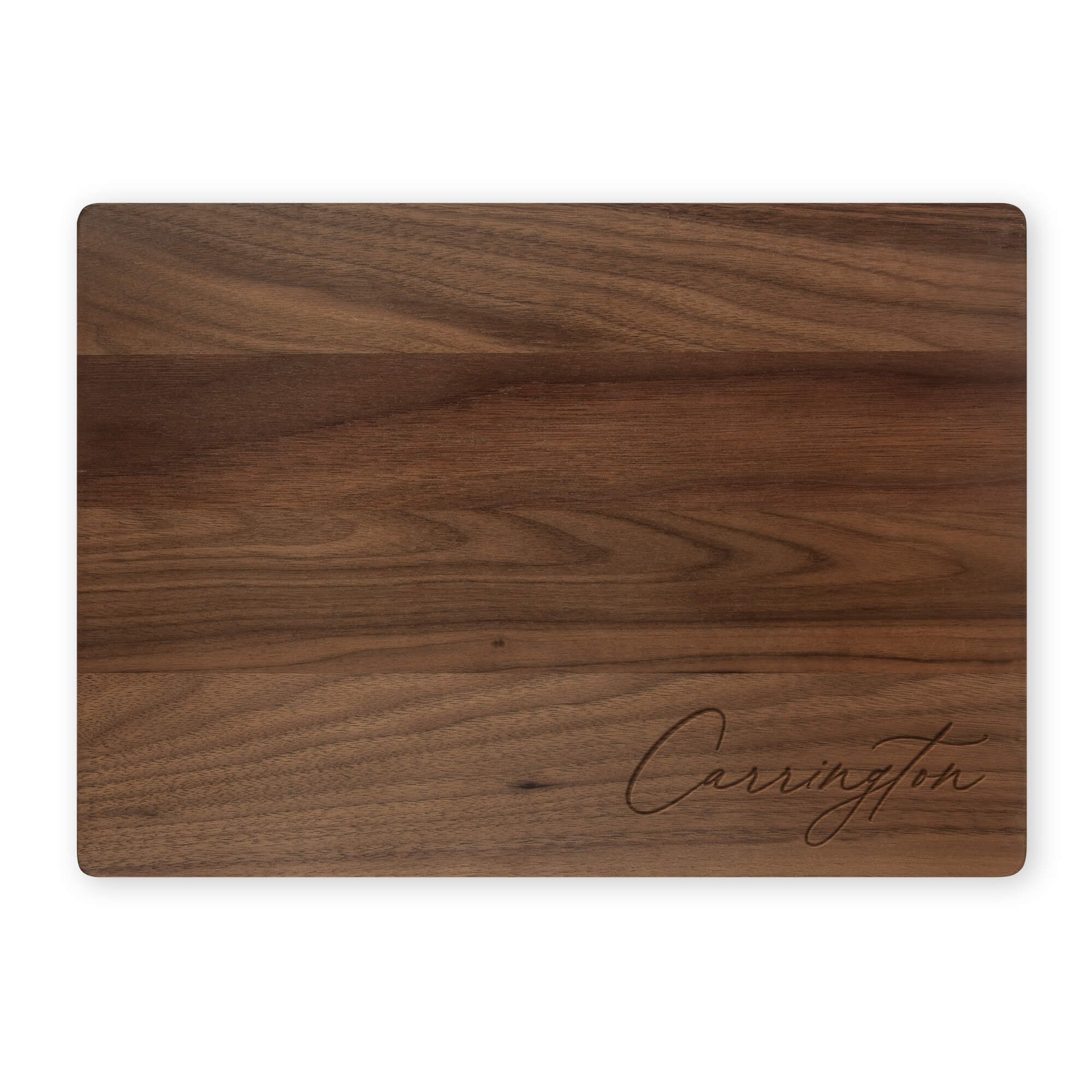 Personalized walnut cutting board engraved with “Carrington” in elegant script. Custom name cutting board or engraved wood serving board, ideal for gifting or kitchen décor.