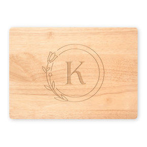 Personalized maple cutting board with circle monogram K on white background